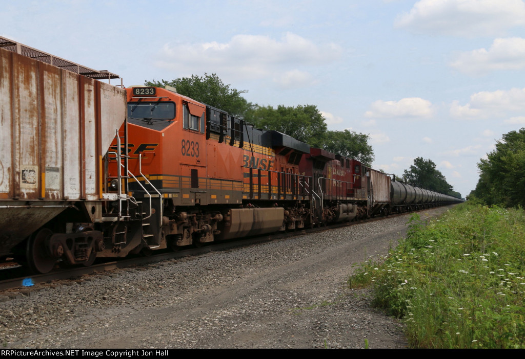 Once the power for 67X-28, BNSF 8233 & CP 9801 roll west as the DPU's after being combined with 67X-29